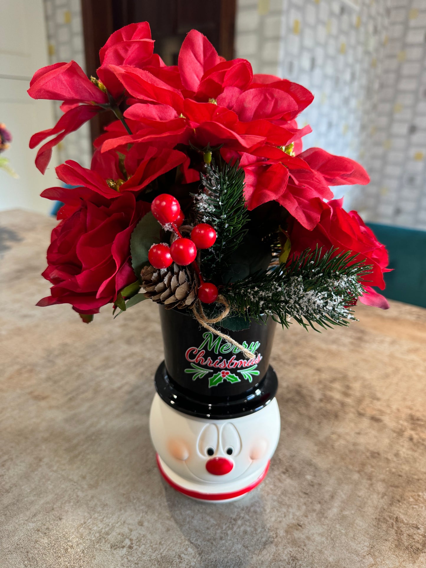 Snowman Christmas arrangement with beautiful red artificial flowers and some red roses