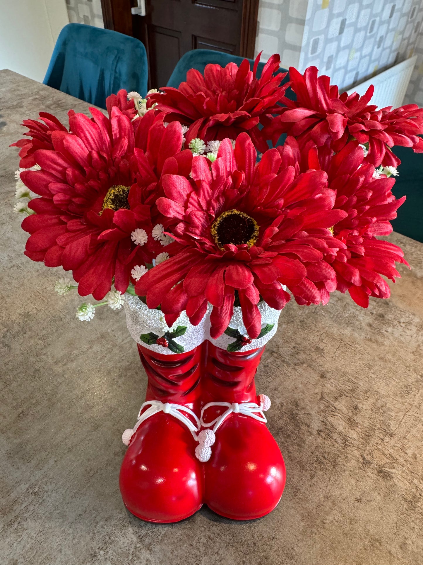 Stunning Christmas boot arrangement of artificial flowers