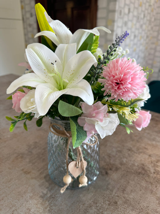 Stunning pink and white artificial arrangement with gorgeous white lilies in a glass jar