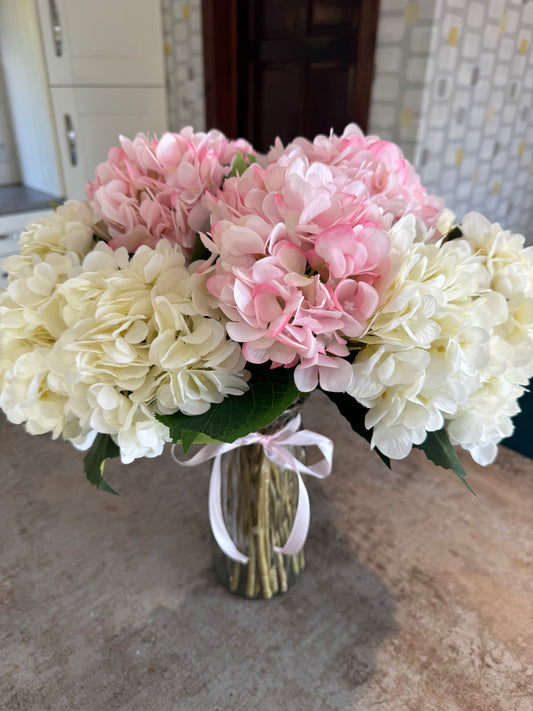 Stunning, 15 large artificial Hydrangeas in a tall glass vase with pink ribbon